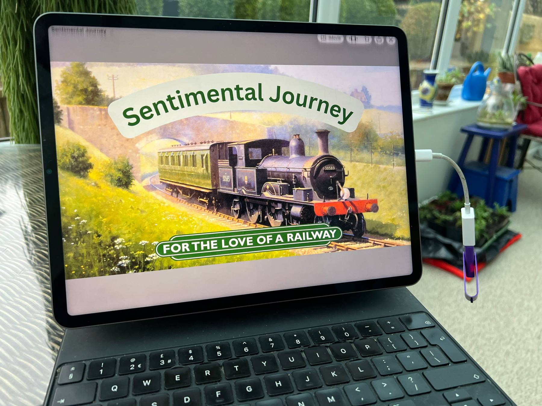 Screen with For the Love of a Railway film playing